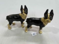 Two cast iron Boston Terrier dogs, 21cm.