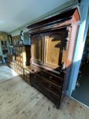 Victorian gents wardrobe having two cupboard doors above two short and two long drawers,