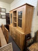 Contemporary light oak ten piece dining suite comprising glazed door top dresser,