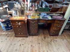 Bevan & Funnell mahogany serpentine front nine drawer pedestal desk, 75cm by 115cm by 53cm,