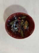 Moorcroft Flambé orchid small bowl, 1950's, rubbed warrant label, 11cm diameter.