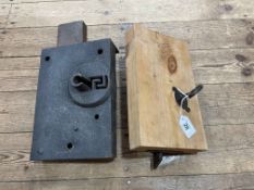 Two early large door locks, one with key.