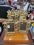 Two pairs of ornate gilt metal photograph frames.