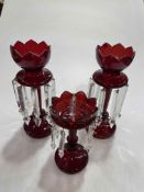Three Victorian red glass lustres.