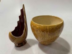 Linthorpe shell shaped vase, no. 1478, and Egyptian decorated jar, no. 1996, tallest 14cm (2).