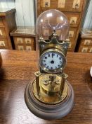 An Edwardian brass mantel clock under dome, 32cm.