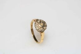 Nine stone diamond illusion set 18 carat gold ring, size K.