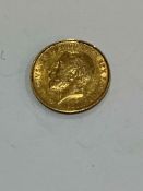 George V 1911 gold half sovereign.