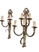 Two gilt metal wall lights including a two branch and a five branch.