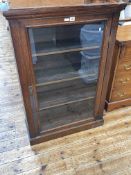Early 20th Century oak glazed door bookcase with three adjustable shelves, 110cm by 77cm by 28cm.