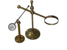Two brass adjustable desk top magnifying glasses.