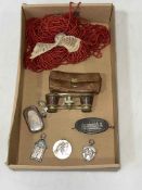 Silver sovereign case, three silver sporting medals, opera glasses, bead necklace,