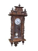 Victorian walnut Vienna style wall clock having enamelled dial and pendulum initialled R & A, 97cm.