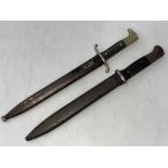 Two bayonets and scabbards.