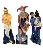 Three Royal Doulton figures, The Genie, The Wizard and The Jester.