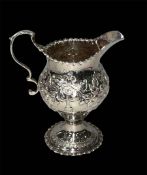 George III silver cream jug by Nathaniel Appleton and Ann Smith, London 1775, 10.5cm.