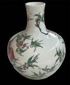 Large Chinese ovoid vase decorated with fruit trees and famille rose on white ground, 35cm.