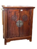 Small Oriental hardwood two door cabinet, 70cm by 55cm by 32cm.