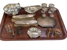 Assorted silver including mirror and two brushes, ashtray, cream jug, napkin rings,