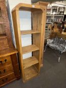 Oak rounded corner top four tier open bookcase, 168.5cm by 50cm by 35cm.