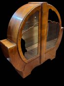 Circular walnut Art Deco two door china cabinet, 125cm by 134cm by 34cm.