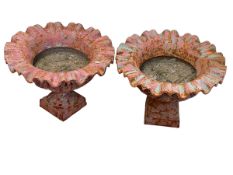 Pair cast pedestal garden urns with crimped rims, 30cm by 42cm diameter.