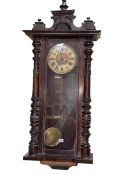 Victorian Vienna style wall clock having enamelled dial and brass pendulum, 117cm.
