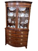 Mahogany and line inlaid bow front bookcase on chest having two astragal glazed doors above a chest