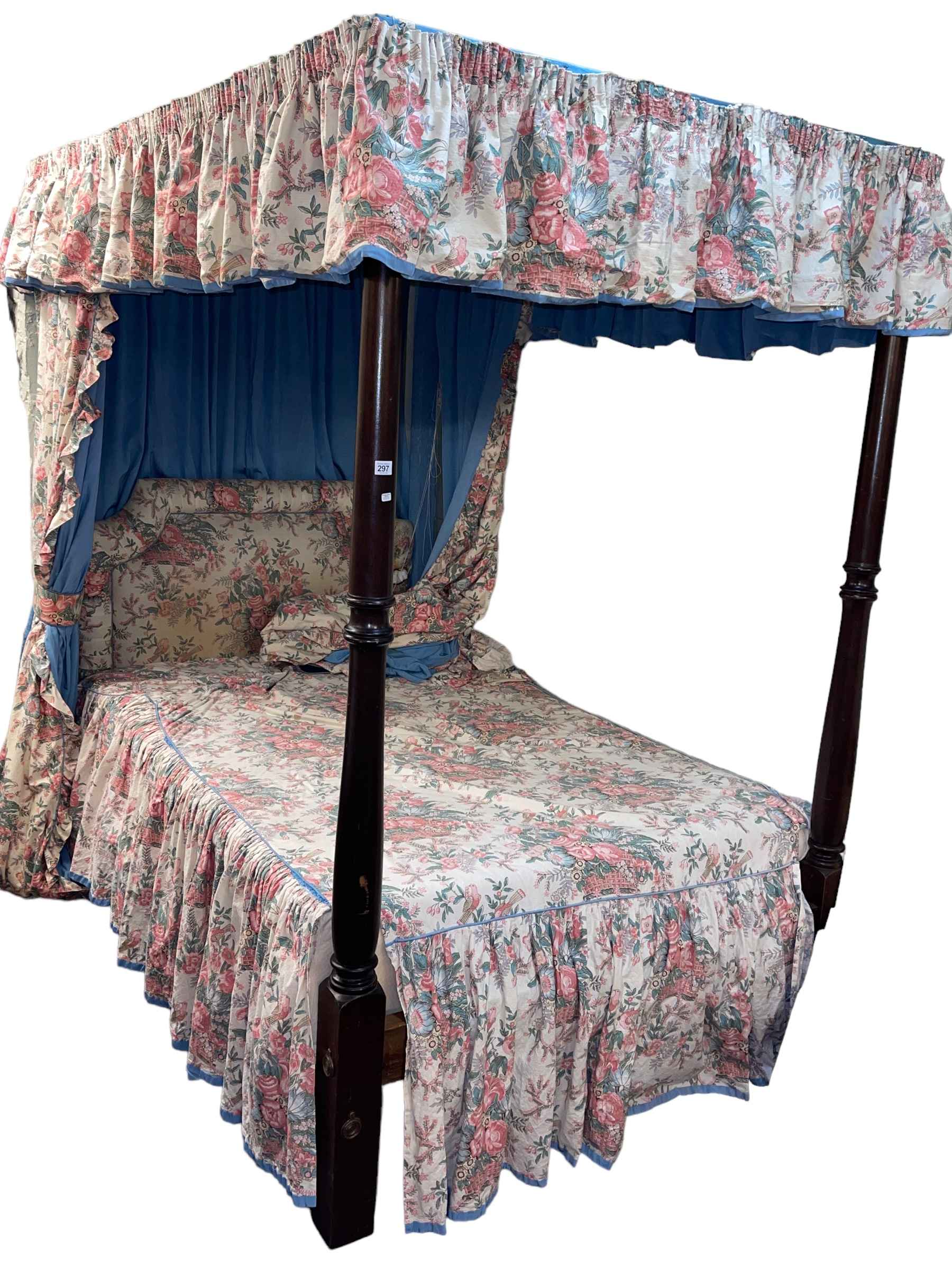 Turned mahogany 4ft four poster bed complete with floral print drapes.