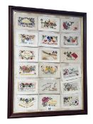 Collection of eighteen WWI silk postcards framed as one, 67cm by 52cm.