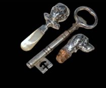 Silver child's rattle, dogs head bottle stopper and novelty key corkscrew (3).