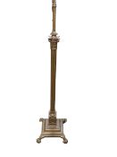 Gilt painted metal Corinthian column standard lamp on claw feet.