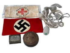 German wartime armbands, portepees, matchbox holder and medal.