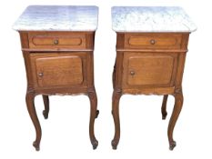 Pair Continental oak and marble topped bedside cabinets, 82cm by 42cm by 38cm.