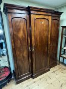 Victorian mahogany breakfront triple door wardrobe, 206cm by 18cm by 65cm.