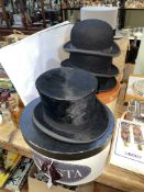 Two top hats, two hunt bowlers, one felt bowler hat (four boxes) and a men's ¾ sheepskin coat.