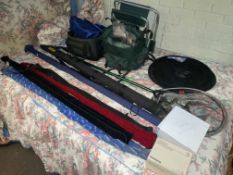 Collection of fishing equipment including rods, reels, net, seat, bags, etc.