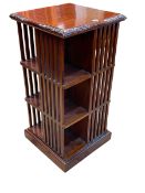 Polished mahogany three tier revolving bookcase, 99cm by 49.5cm by 49.5cm.