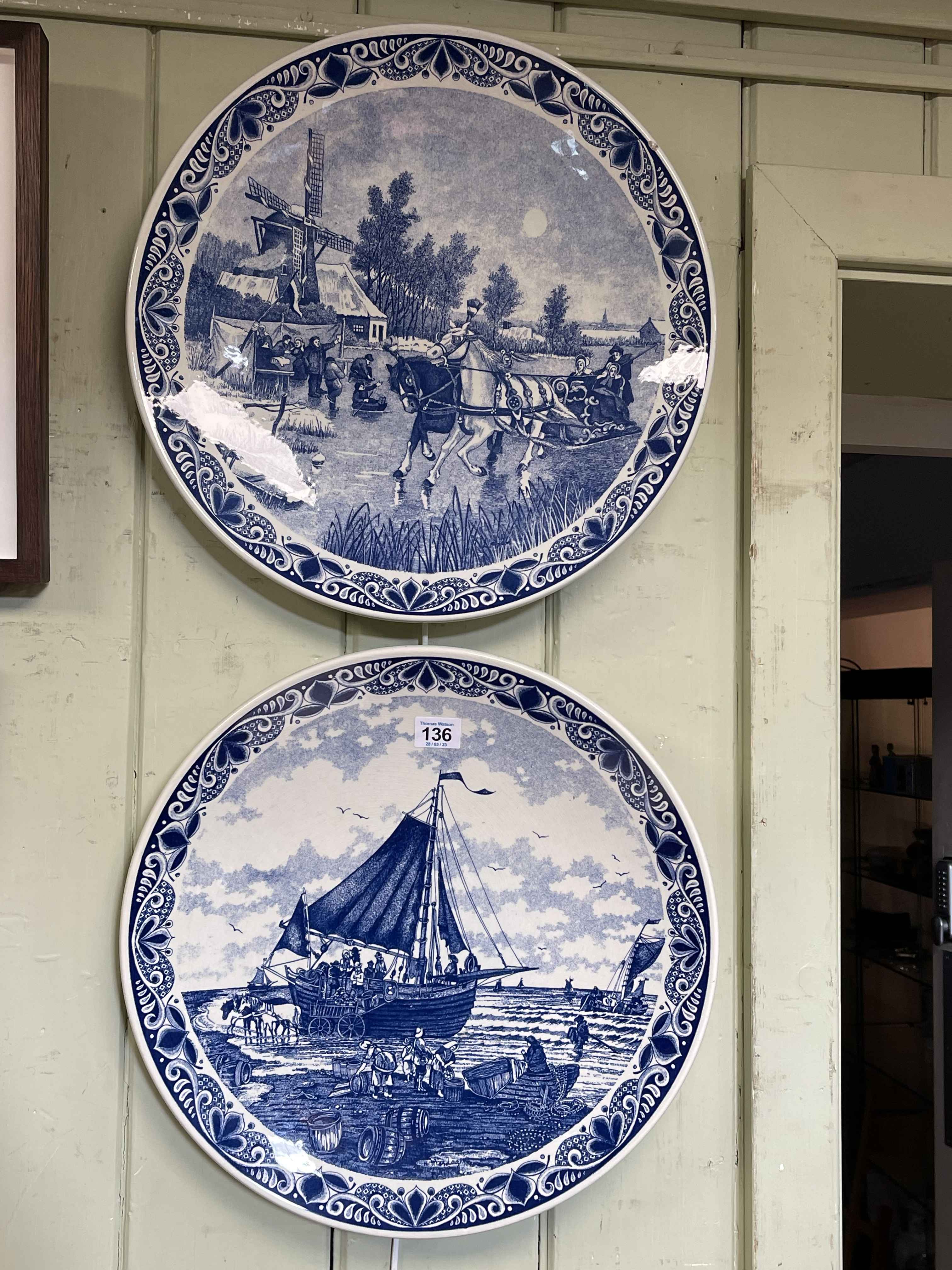 Pair of blue and white Delft wall plaques, 39.5cm diameter.