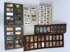 Three albums of cigarette cards and collection of loose.