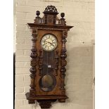 Gustav Becker walnut pendulum wall clock having initialled enamelled dial, 122cm.