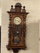 Gustav Becker walnut pendulum wall clock having initialled enamelled dial, 122cm.