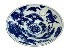 Chinese blue and white shallow bowl decorated with dragon and horse, 23cm diameter.