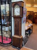 Antique oak and mahogany eight day longcase clock having painted arched dial, signed Swinburn,