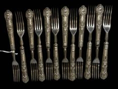 Set of twelve shell and scroll silver handled dessert forks.