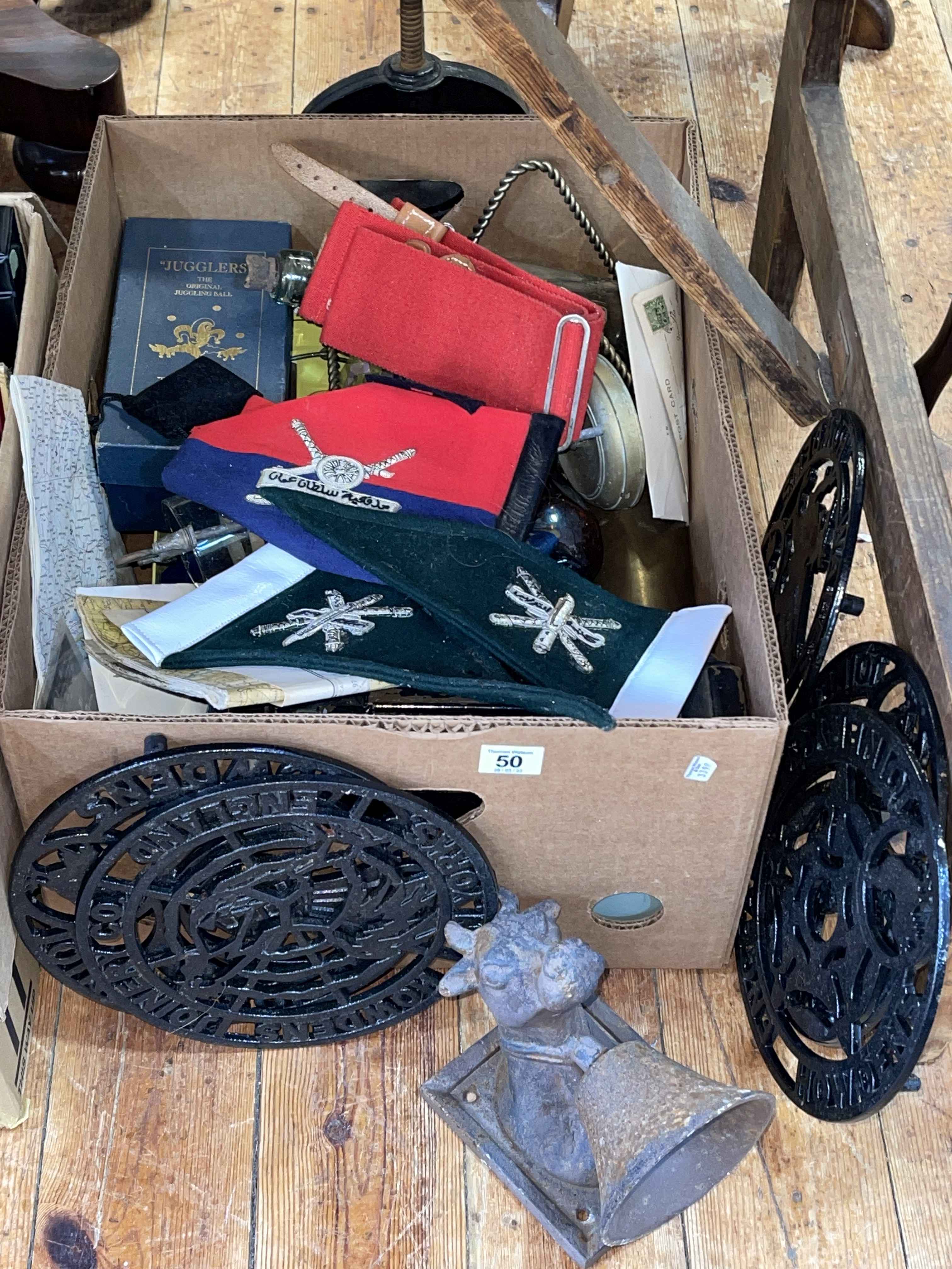 Box with trivets, pennants, miscellaneous.