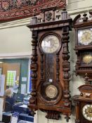 Victorian walnut Vienna style pendulum wall clock having enamelled and embossed dial and embossed