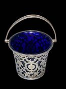 Edwardian silver pierced and engraved basket with blue glass liner, Birmingham 1907,