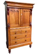 Victorian satin birch linen press having two panelled doors above two short and two long drawers on