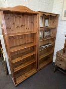 Two pine five tier open bookcases.